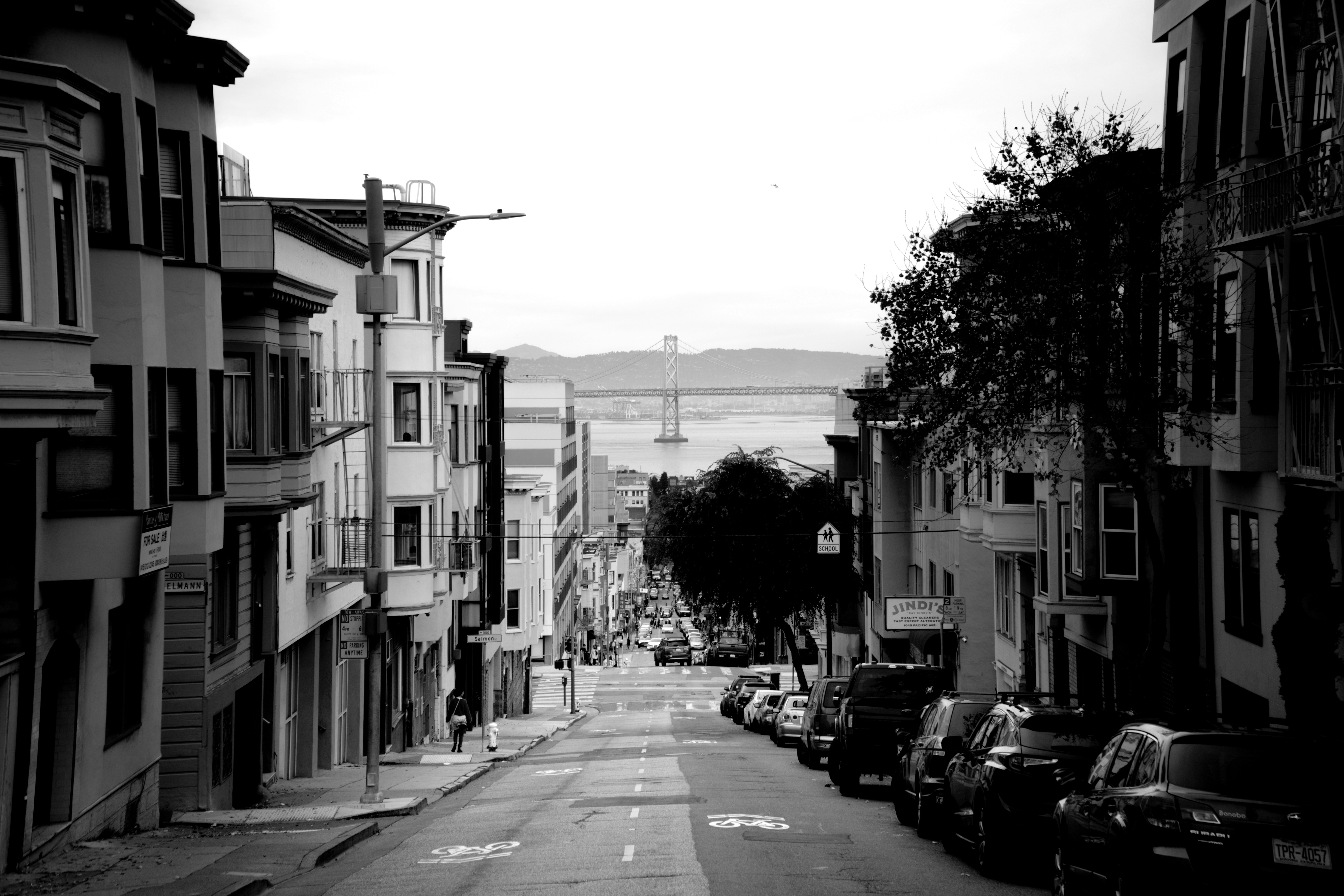 a street with cars parked on the side
