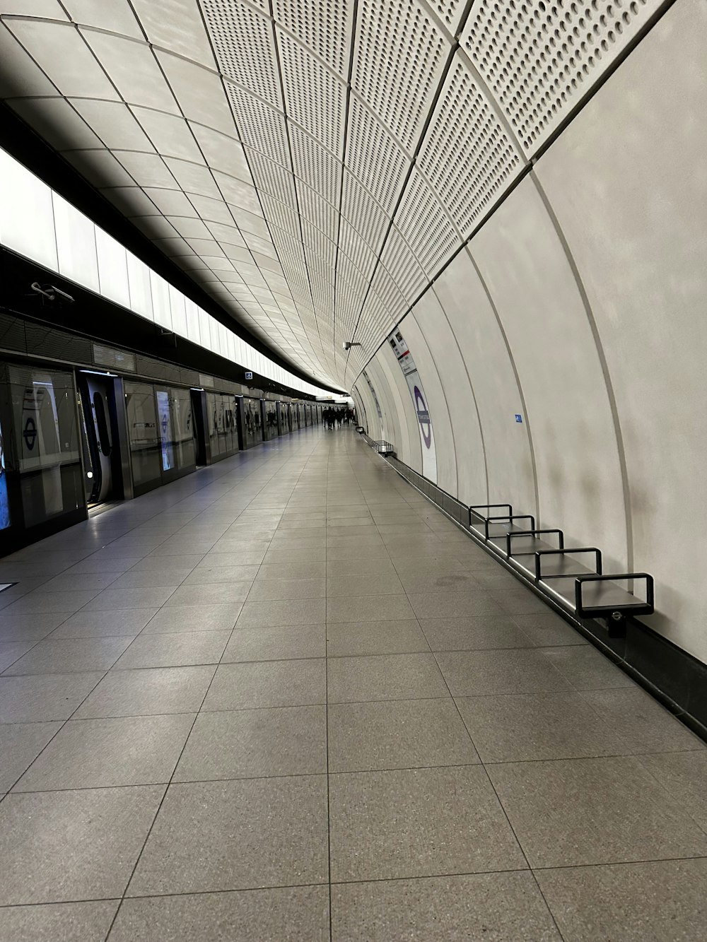 a long hallway with benches