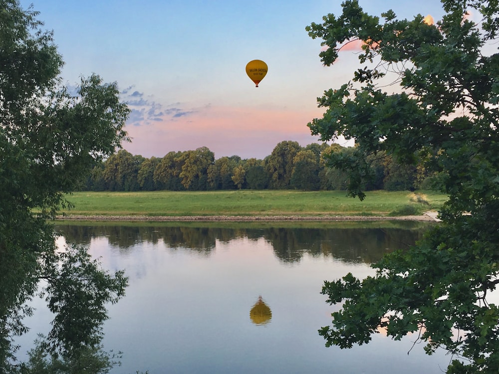 a hot air balloon over a lake