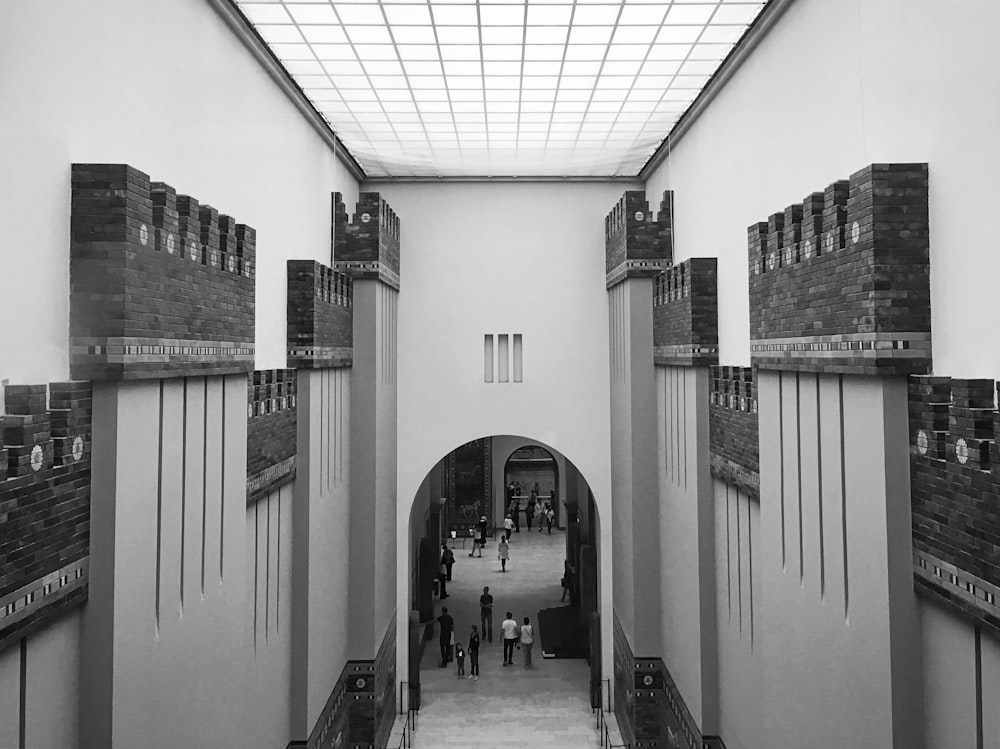 a group of people walking through a building