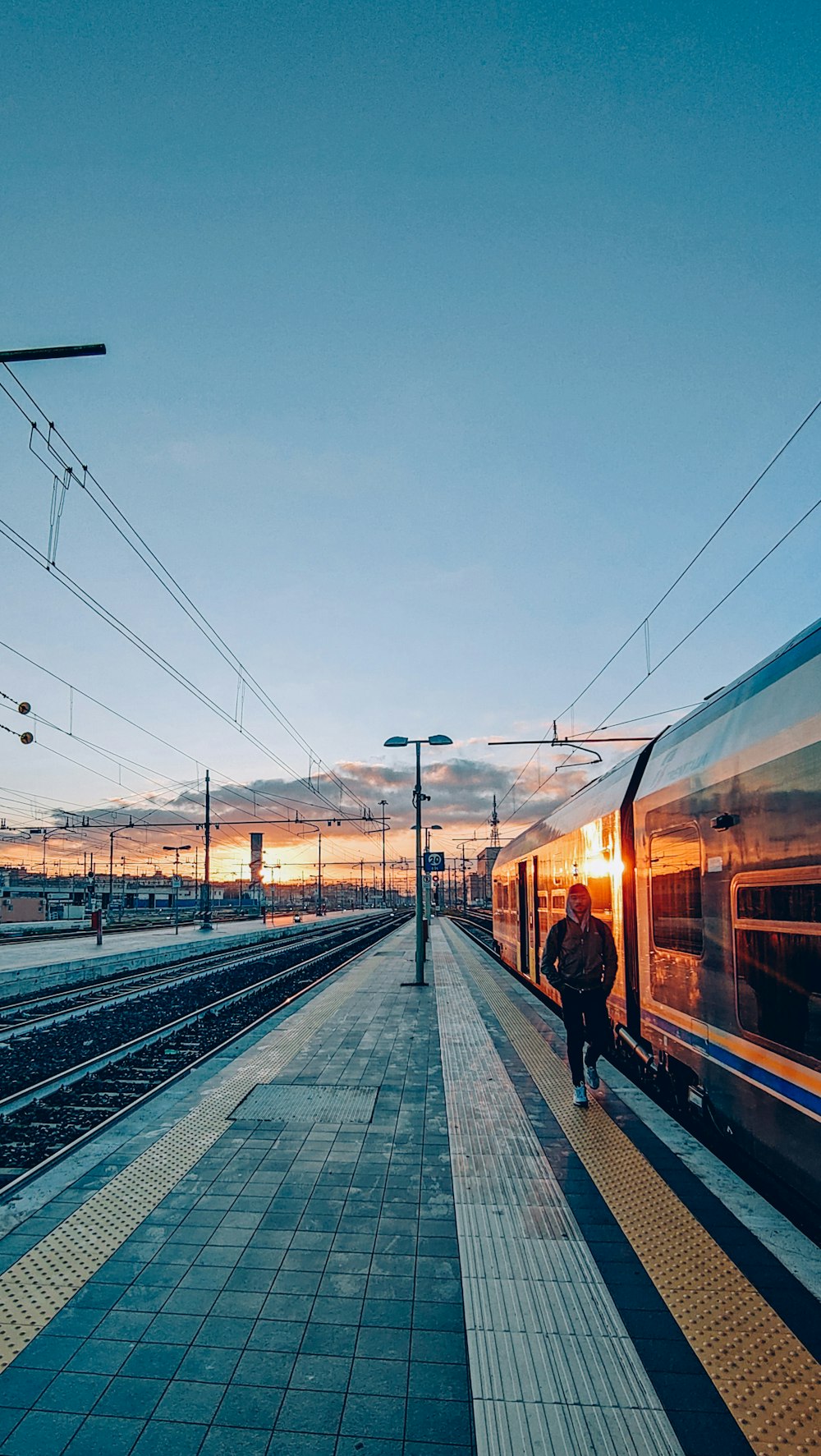 a person walking on a train platform