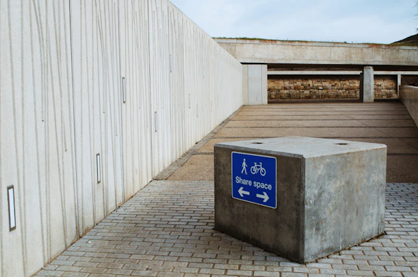a concrete box with a sign on it