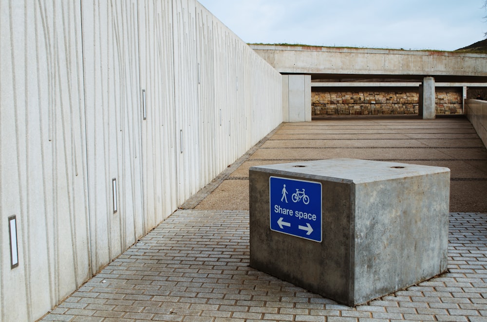 a concrete box with a sign on it