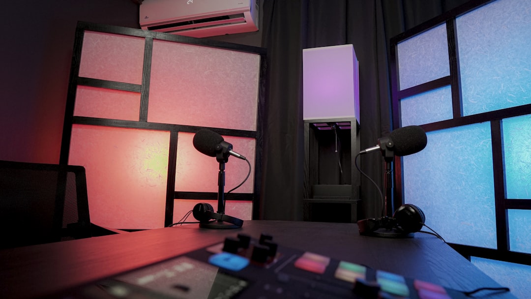 a desk with a lamp and a window,