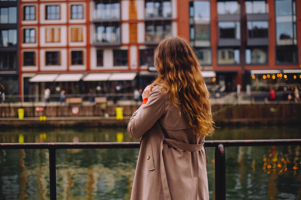 a person standing in front of a body of water