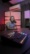 a person sitting at a microphone