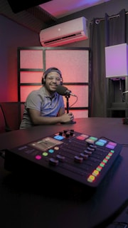 a person sitting at a microphone