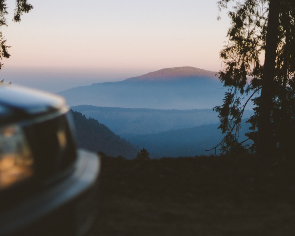 a view of a mountain range from a window