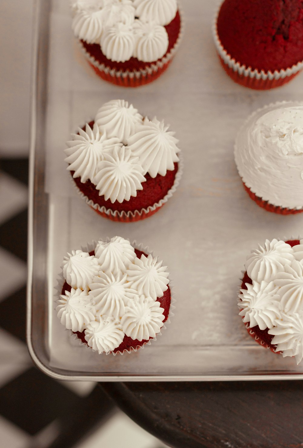 a group of cupcakes with white frosting