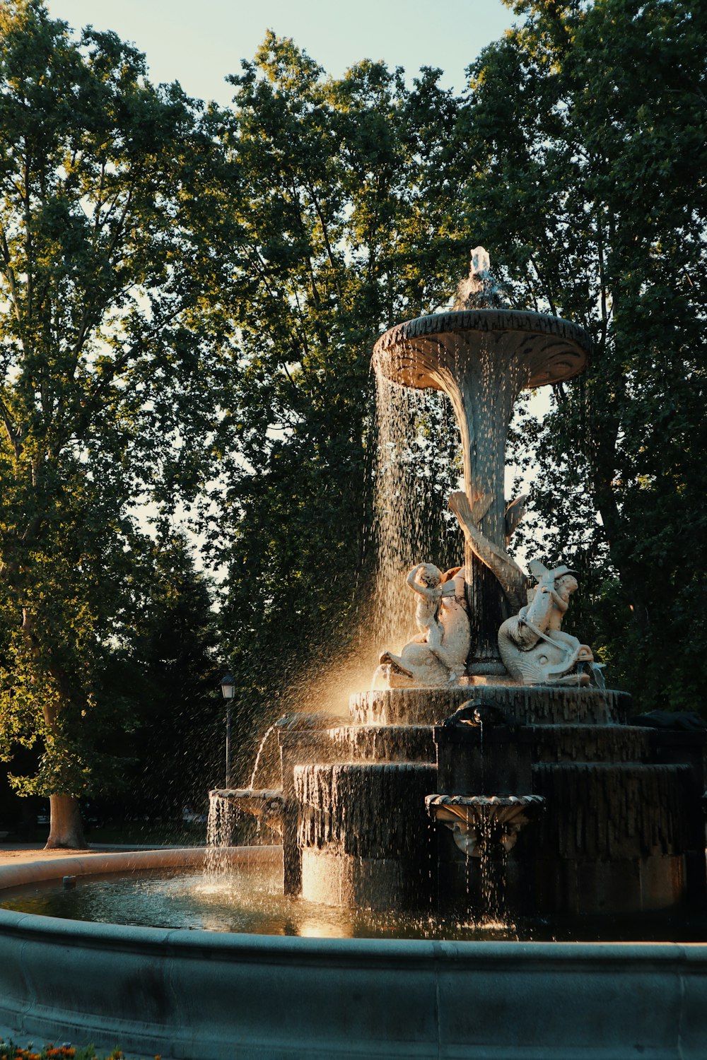 a fountain with statues in it