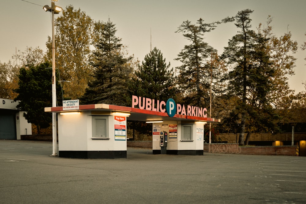 a store front with trees in the background