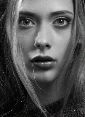 A dramatic black-and-white portrait of a fighter’s intense gaze.