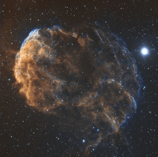 A scientist examining a glowing nebula through a digital screen.
