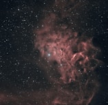 A mystical cosmic scene with stars and nebulae forming intricate spiritual shapes.