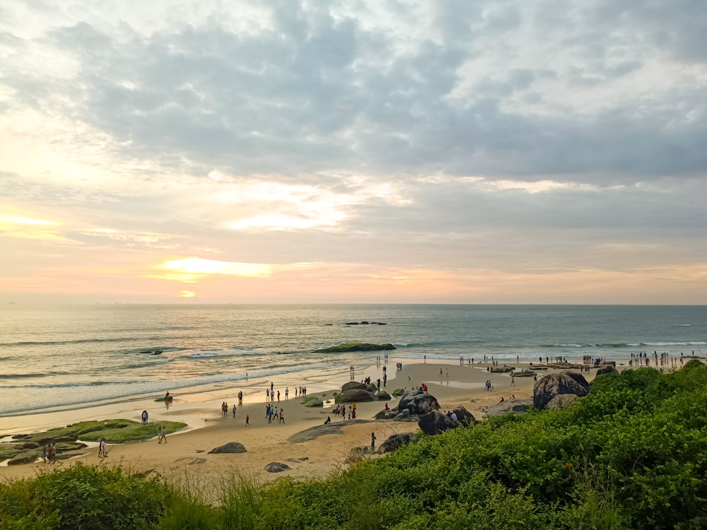 a beach with people and buildings