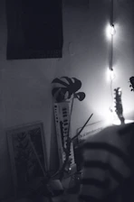 a guitar leaning against a wall