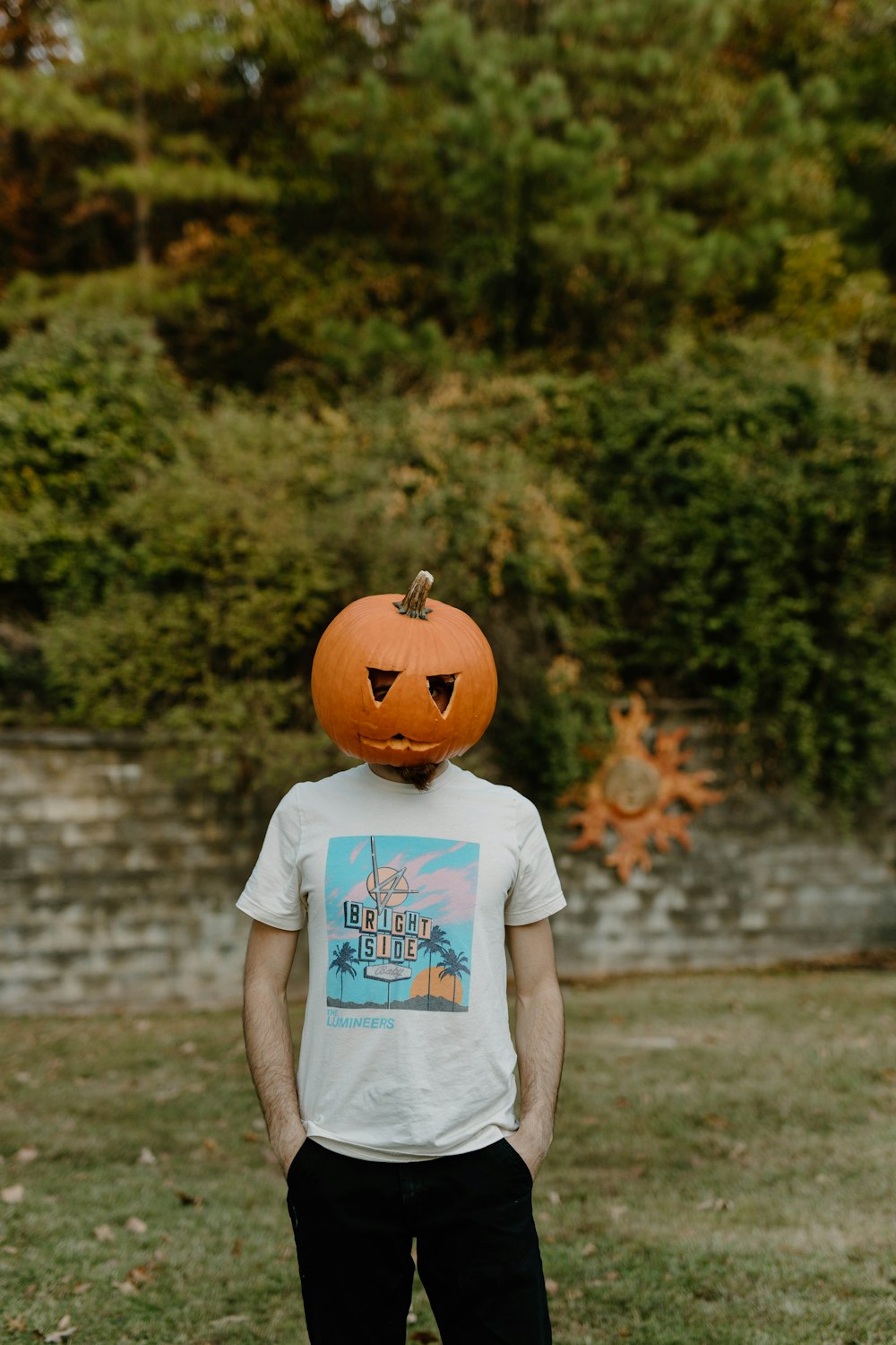 a person wearing a pumpkin hat