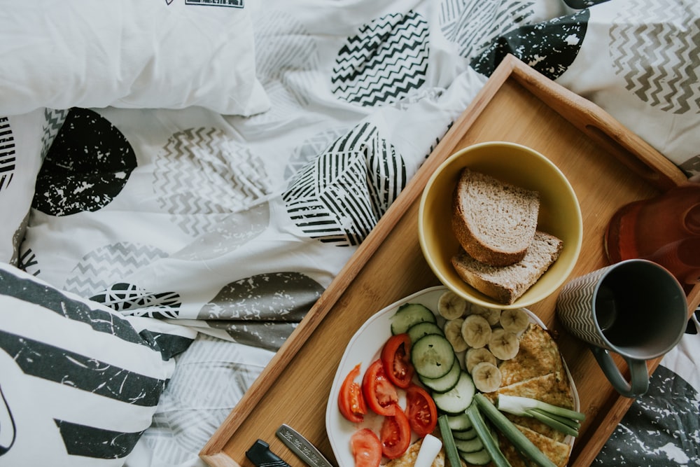 a plate of food and a cup of coffee on a table