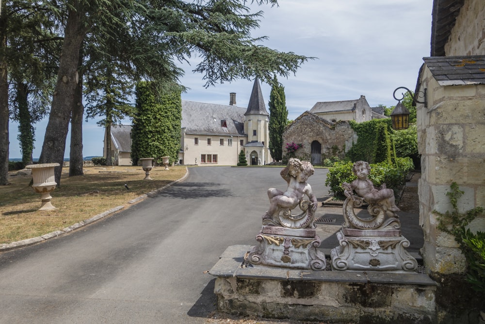 a stone bench with statues on it