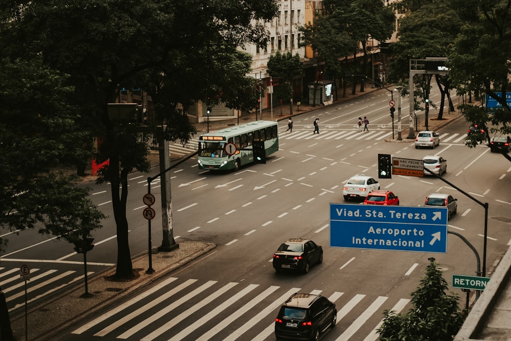 a bus and cars driving down a street