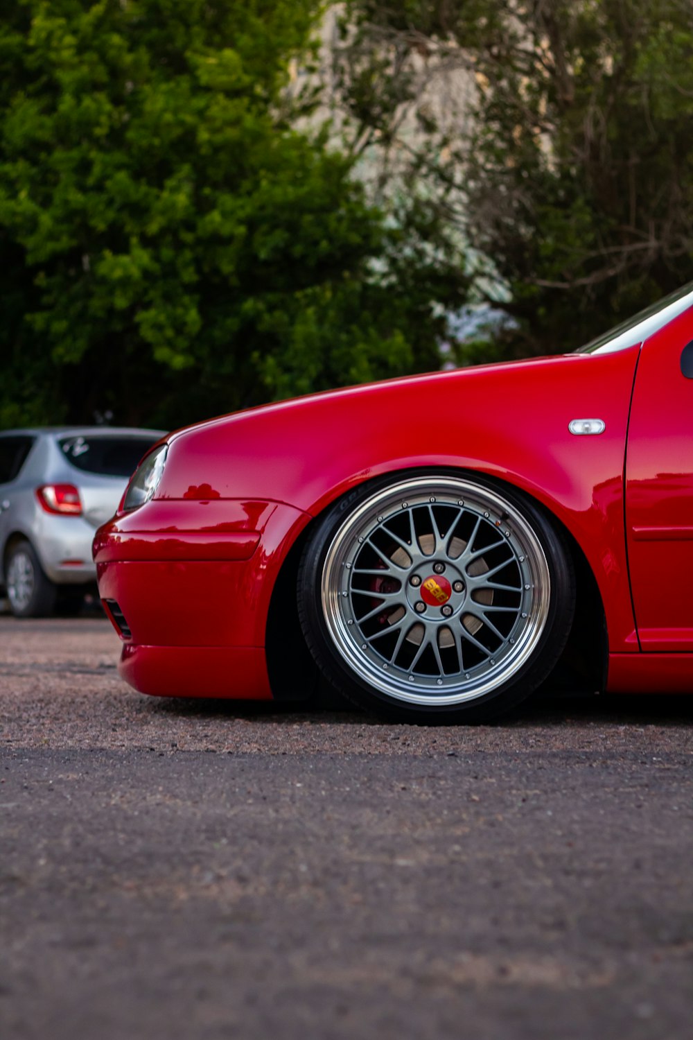 a red car parked on a road