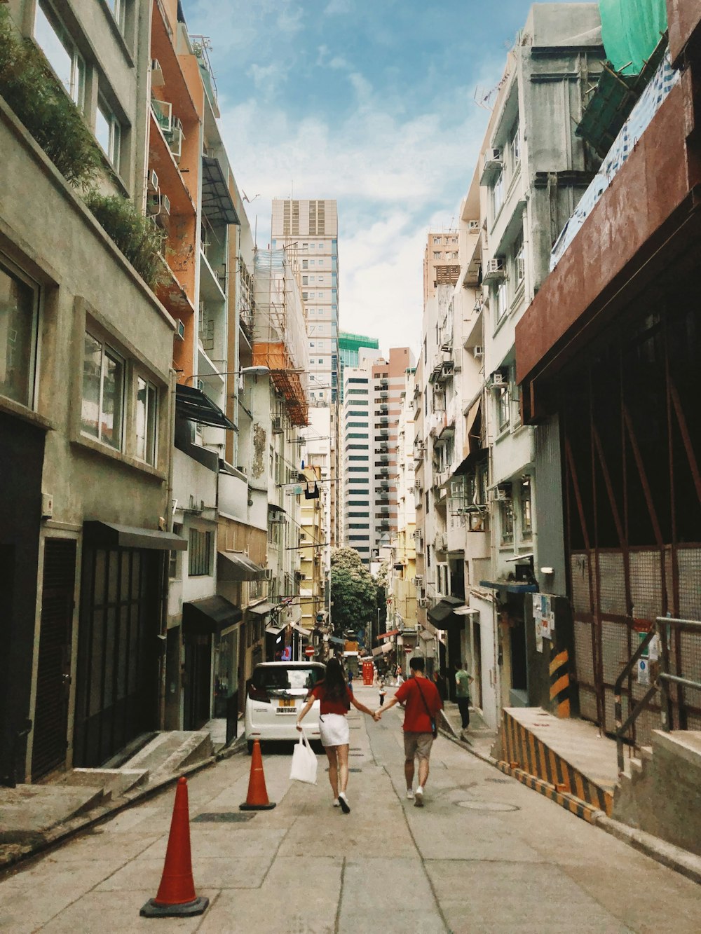 a couple walking down a street