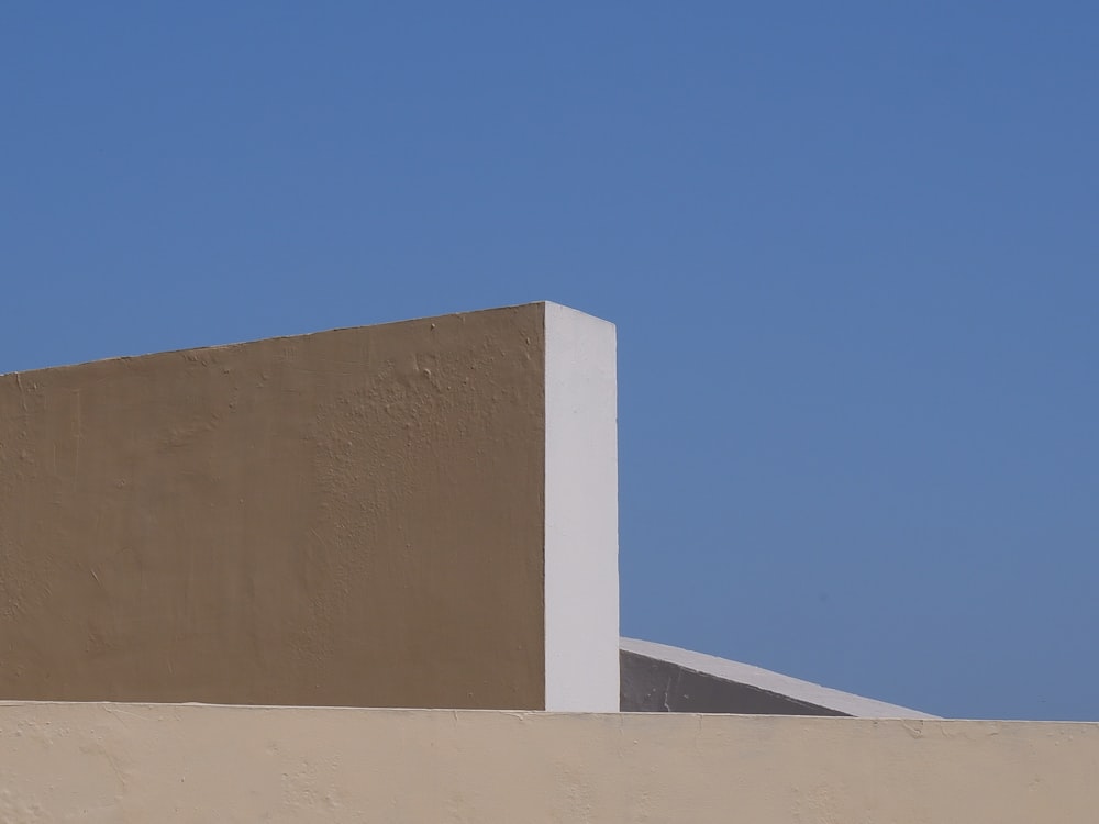 a sand dune with a blue sky