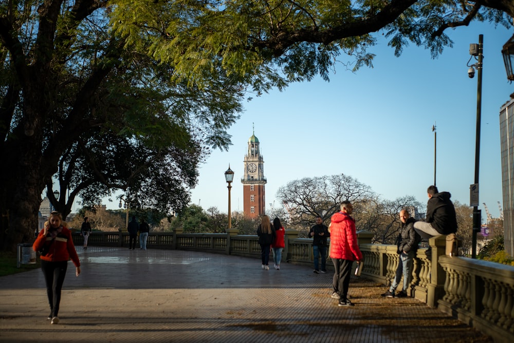 people walking on a sidewalk