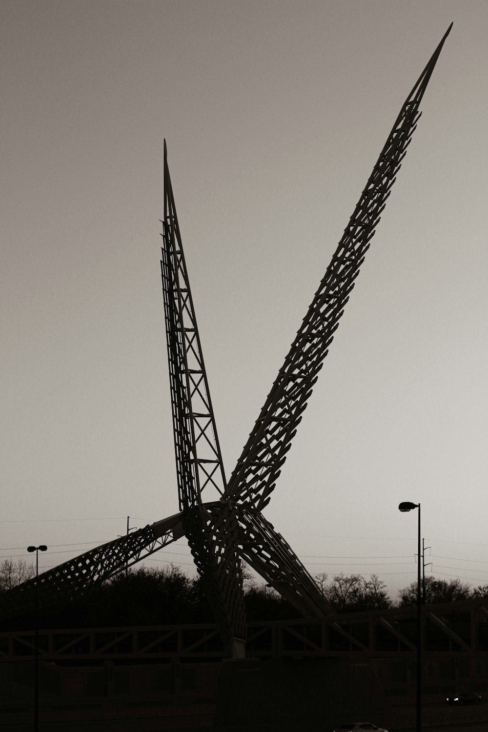 a large crane next to a bridge