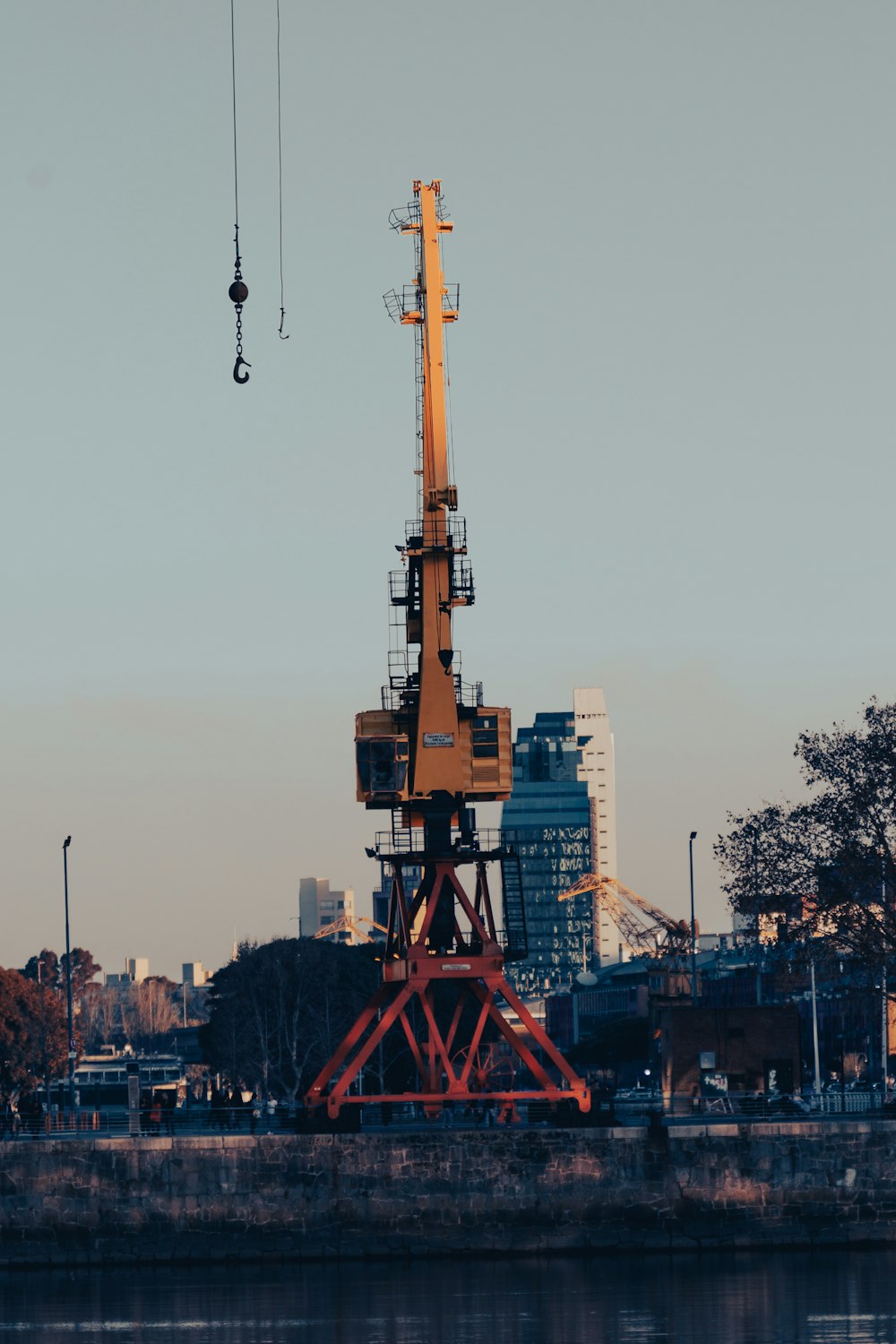 a red tower with a crane