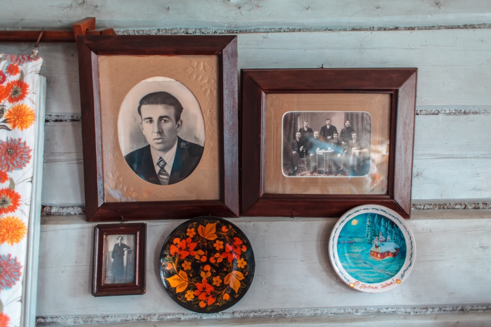 a group of framed pictures on a wall