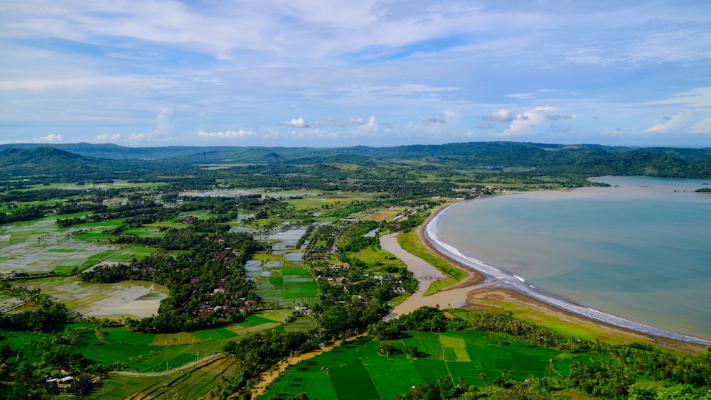 a landscape with a body of water and land with trees