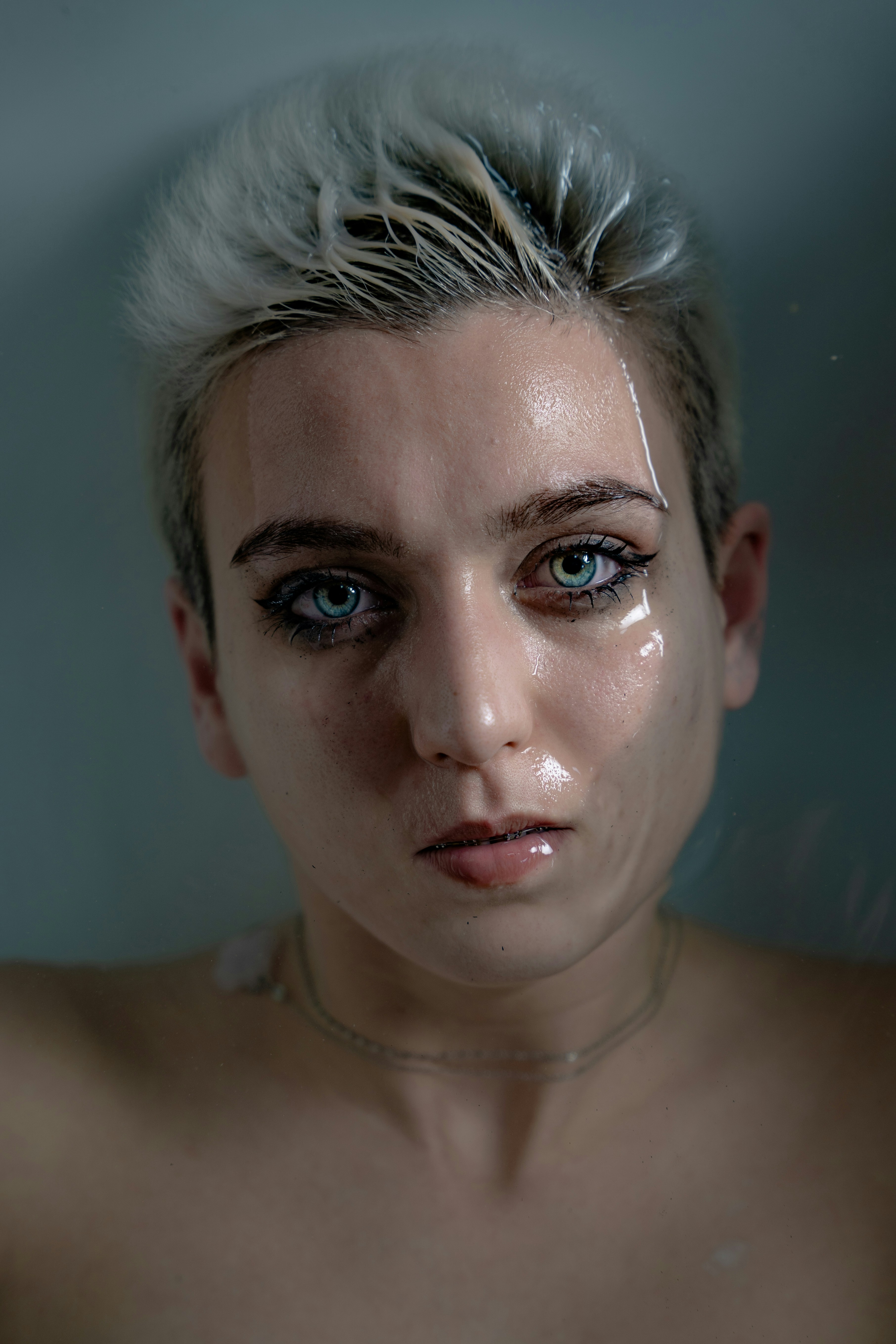 wet finish pixie cut with frosted tips