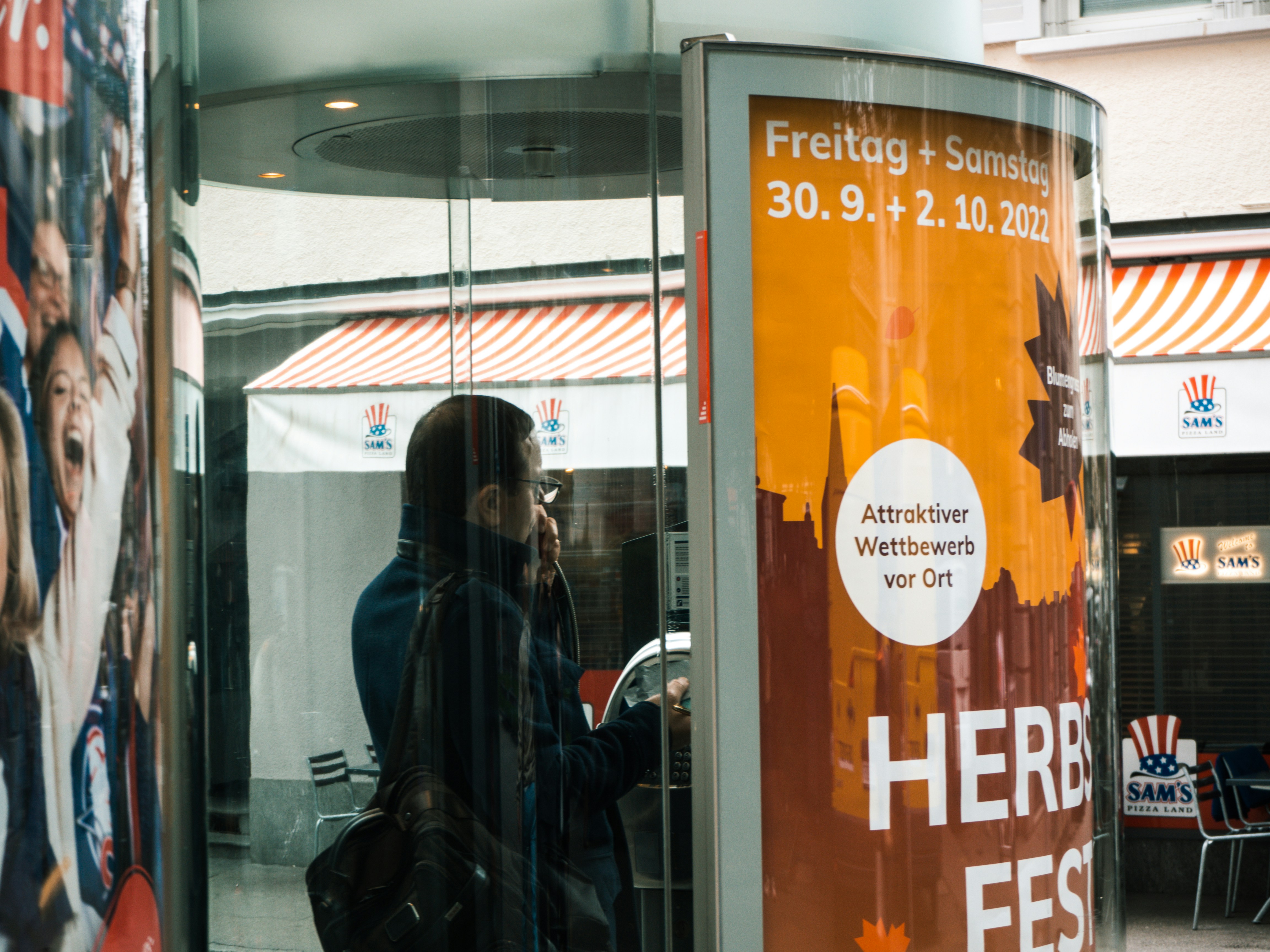A person walking out of a building photo Free Switzerland Image on