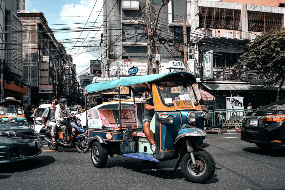 a person riding a small scooter on a busy street