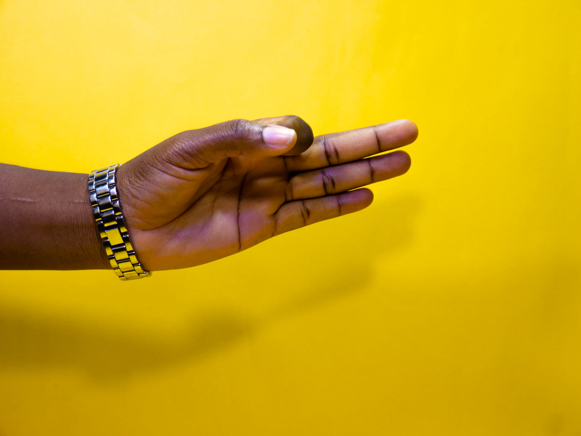 a close-up of hands shaking