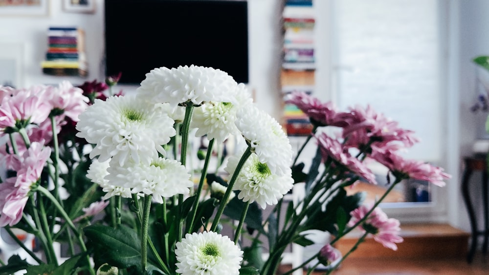 a bouquet of white and pink flowers