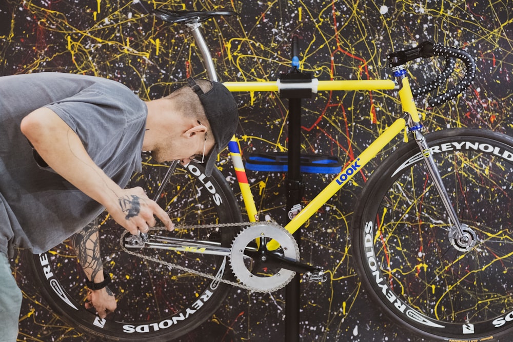 a person fixing a bicycle