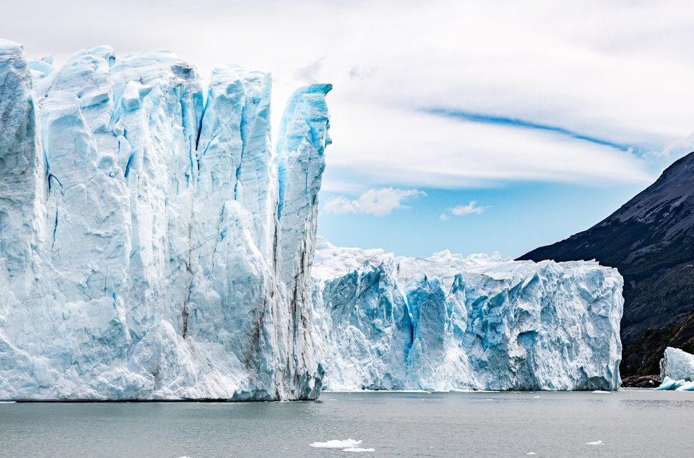 a group of icebergs in the water