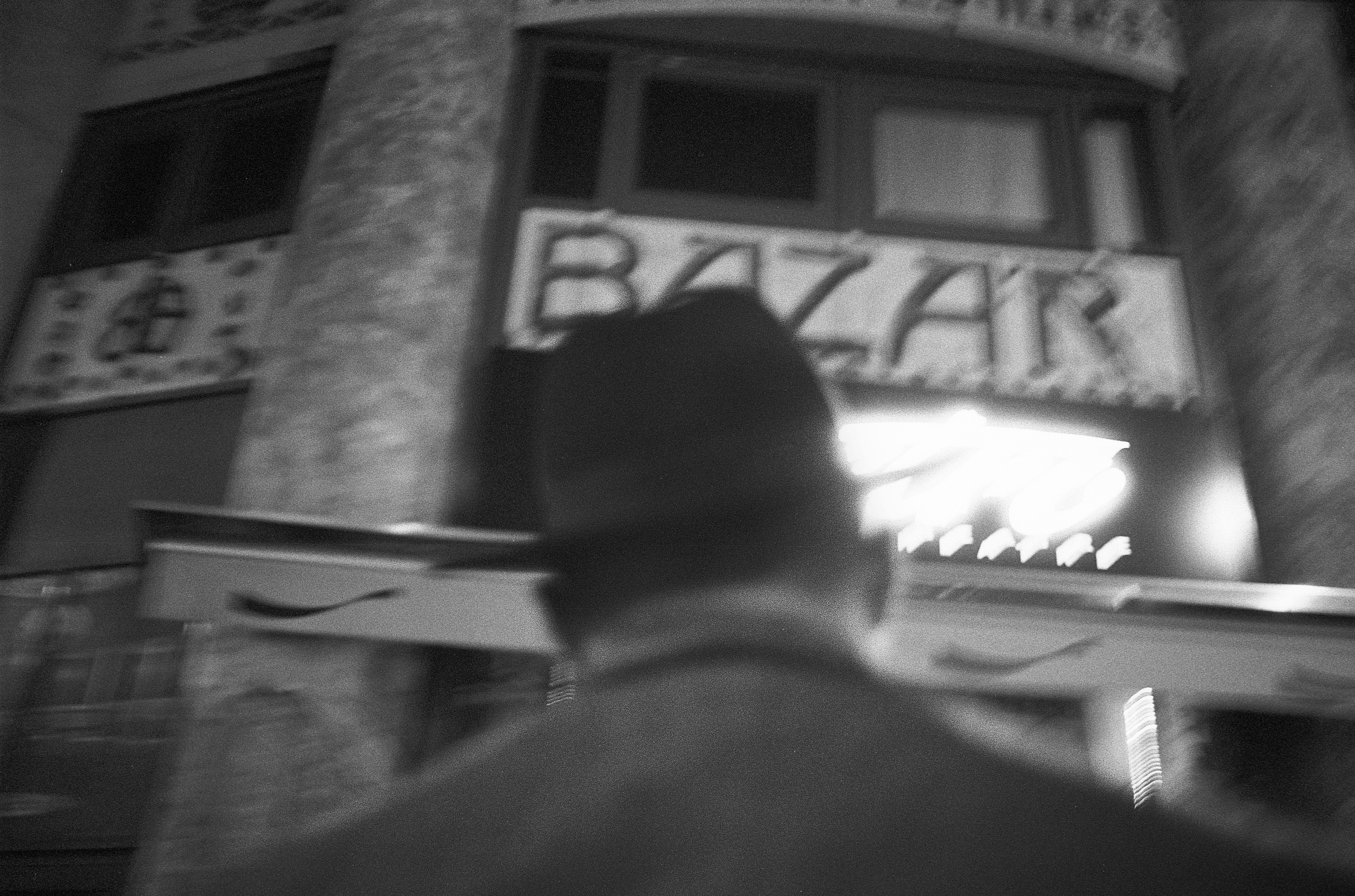 a person sitting in front of a building