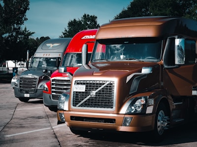 a group of trucks parked in a parking lot