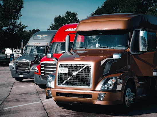 a group of trucks parked in a parking lot