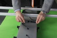 Close-up of earthing system components being securely connected by a technician.