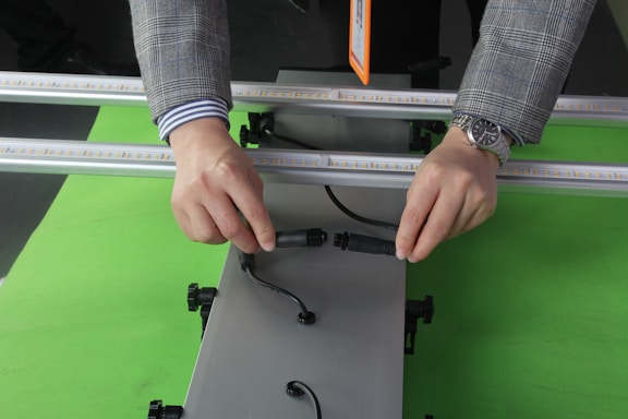 A friendly electrician assisting a customer with wiring in a modern home.