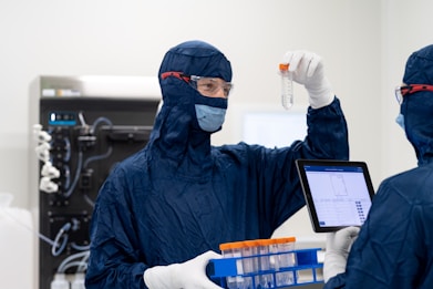 a group of people wearing protective gear and holding a tablet