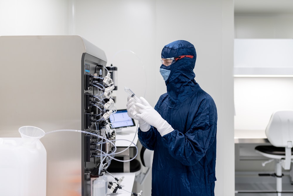 a man in a lab coat using a phone