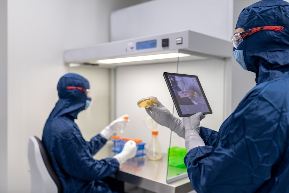 a few people in blue lab coats