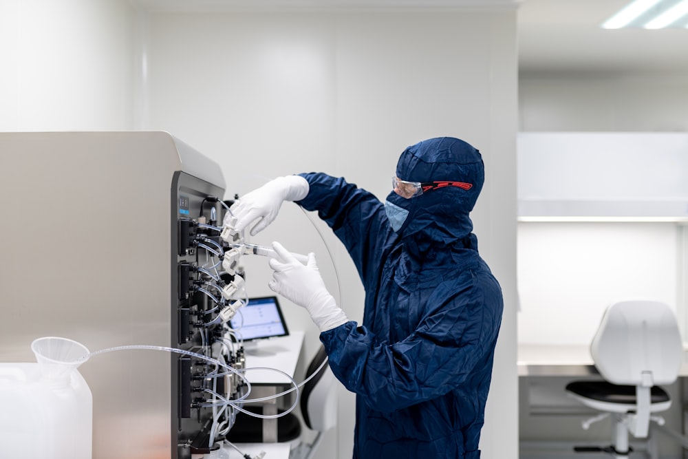 a person in a lab coat working on a computer