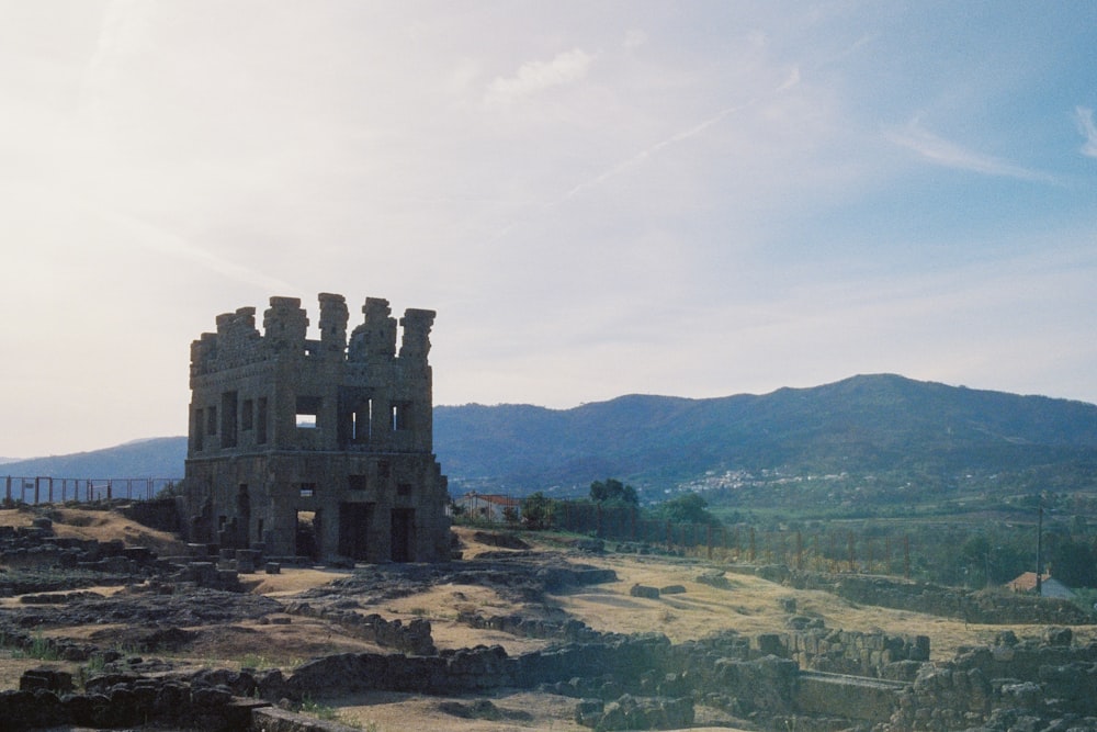 a stone building on a hill