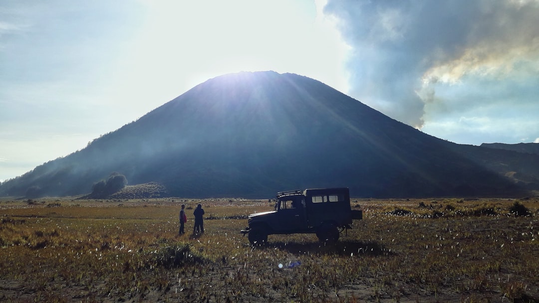 a truck parked in a field, Adventure at Bromo